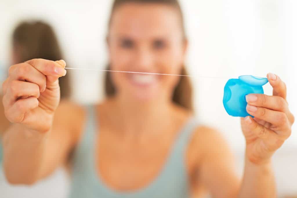 floss before brushing your teeth